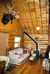 View of living room in log cabins.