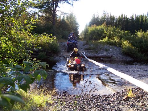 Water crossing at the whitefish river while ATV riding.