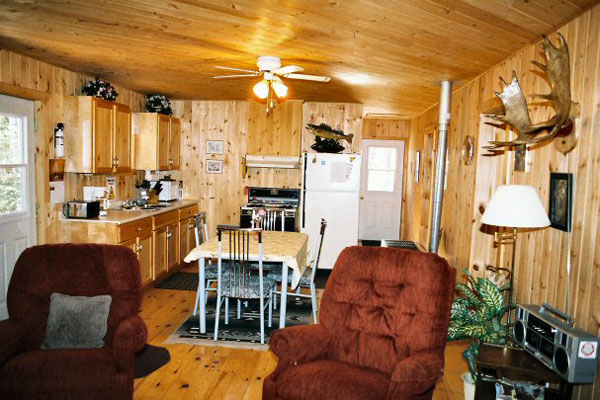 Living room and kitchen inside deluxe three bedroom cottage.